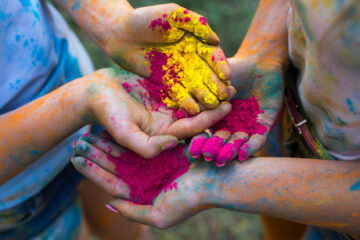 Children's hands covered in powder paint