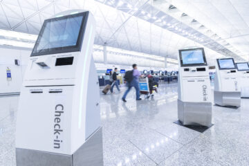 Self service machine and help desk kiosk at airport for check in, printing boarding pass or buying ticket
