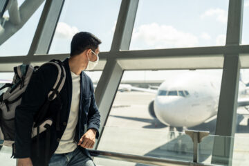 Traveller in face mask at airport