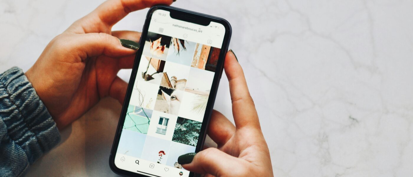 Hands holding iPhone